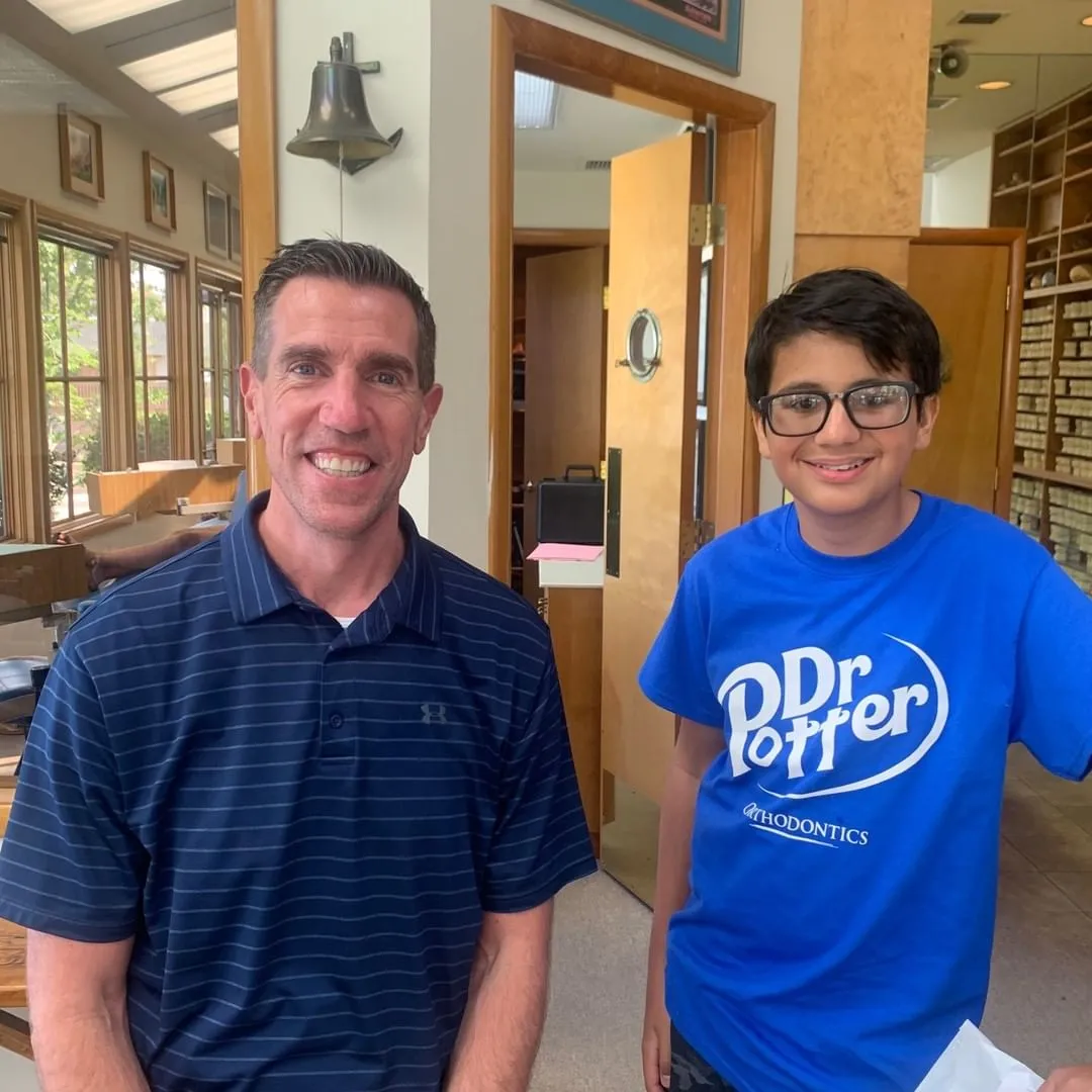 Dr. Potter and young boy smiling