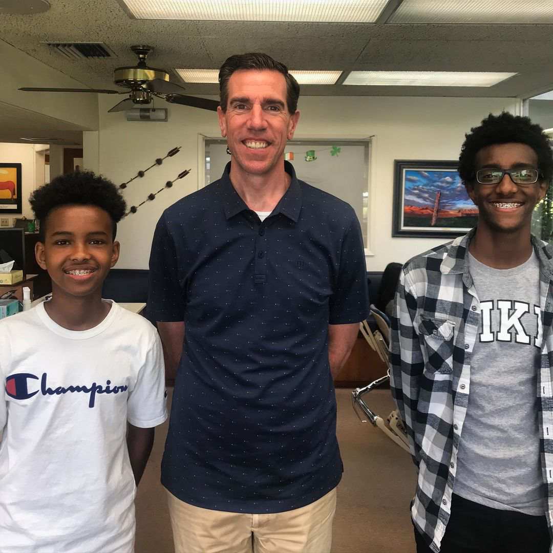 Dr. Potter and two young boys smiling