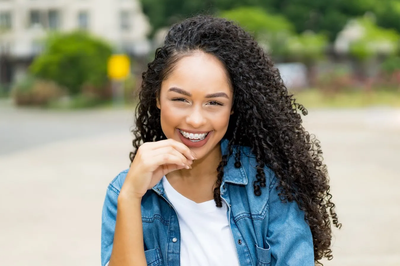 Woman smiling and wearing braces