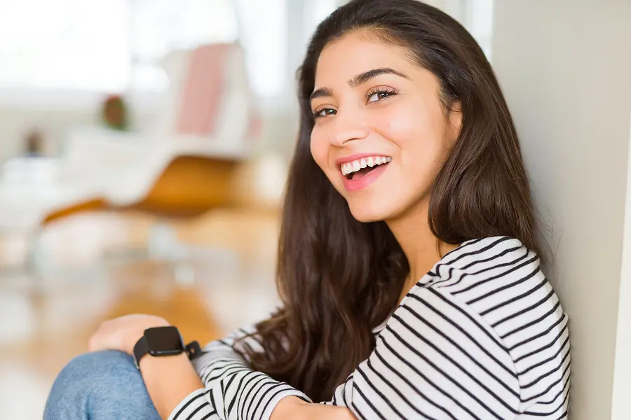 Woman sitting down smiling