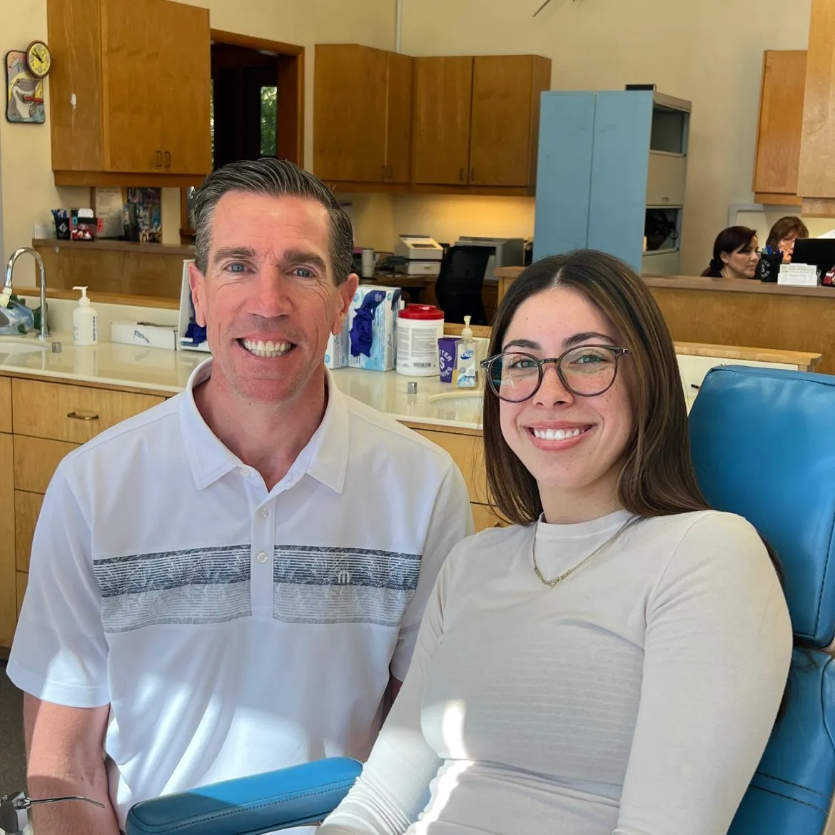 Smiling orthodontist and patient in dental office, showcasing adult orthodontic care and consultation at Potter Orthodontics.