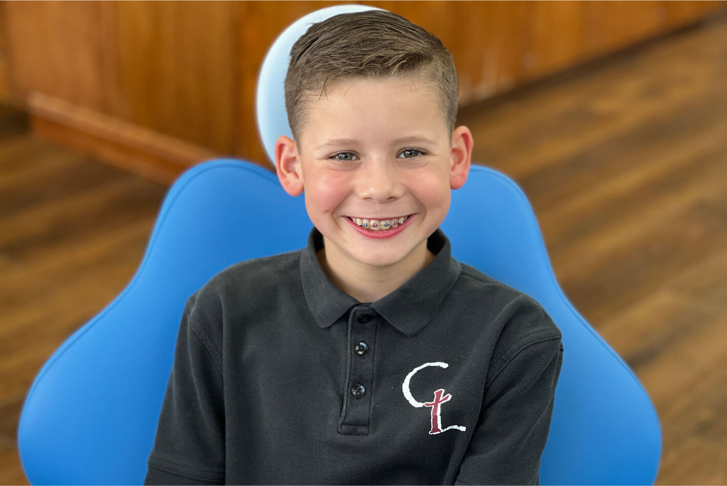Young boy smiling with braces