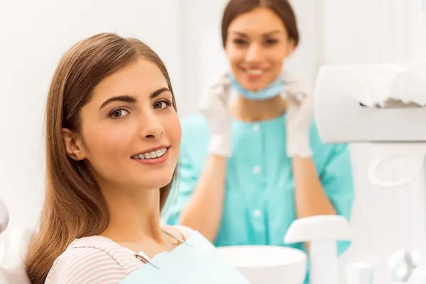 Woman with braces smiling